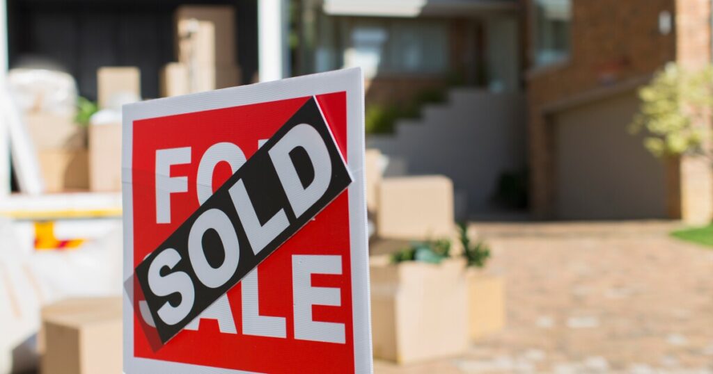 Existing-home sales edge down as high costs stymie buyers